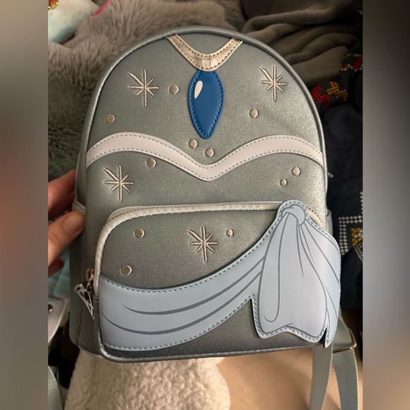 Loungefly Handbags - Loungefly Tiana Metallic Silver Backpack with Blue Gem